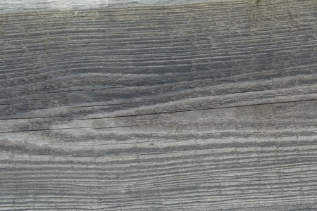 Old dark wooden texture. Close up of wooden plank useful as background