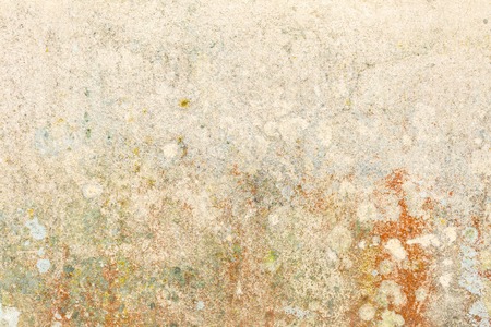 Old wall yellow background. Close up of wall texture. Stained and scratched wall.の写真素材