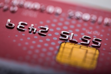 Credit card in close up. Abstract photo of bank card with shallow depth of fieldの写真素材