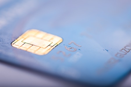 Credit card in close up. Abstract photo of bank card with shallow depth of field