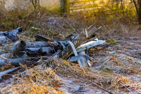 Unlegal dump near forest. Devastation of nature with rubbish