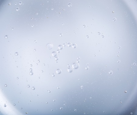 Oil droplets on water surface. Abstract background with shallow depth of field. Liquid abstract.