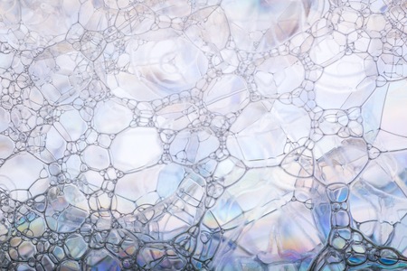 Air foam bubbles in close up. Soap foam macro abstract.