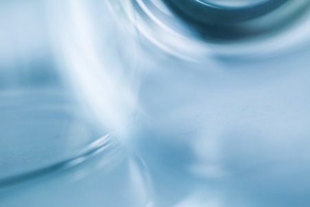 Glass blurry abstraction. Thick or thin glass in big close up - artistic abstract background.の写真素材