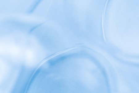 Glass blurry abstraction. Thick or thin glass in big close up - artistic abstract background.の写真素材