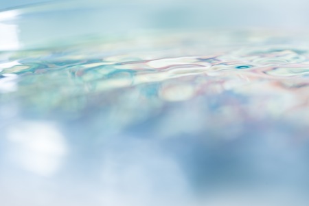 Abstract macro of water surface. Colorful macro abstraction of liquid surface.