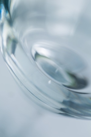 Glass blurry abstraction. Thick or thin glass in big close up - artistic abstract background.の写真素材