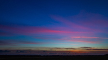 Beautiful vibrant sky over fields in Poland. Horizon and sky over fields.の写真素材