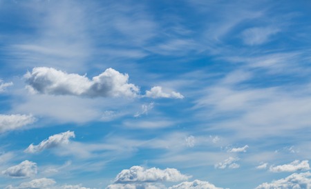 Beautiful blue sky with white clouds background. Nature backdrop with sky.
