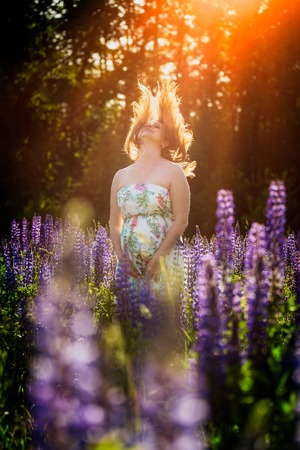Pregnant woman outdoor portrait. Beautiful caucasian pregnant woman.の写真素材