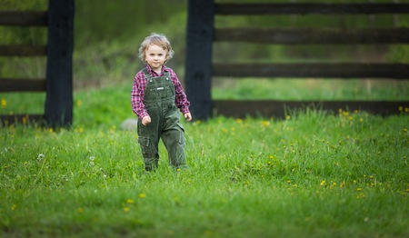 Handsome caucasian young baby boy playing outdoor in spring. Caucasian boy in outdoor.の写真素材