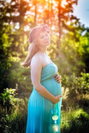 Pregnant woman outdoor portrait. Beautiful caucasian pregnant woman.の写真素材