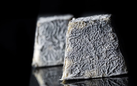 Studio schot of traditional goat cheese Valencay. Luxury food.の写真素材