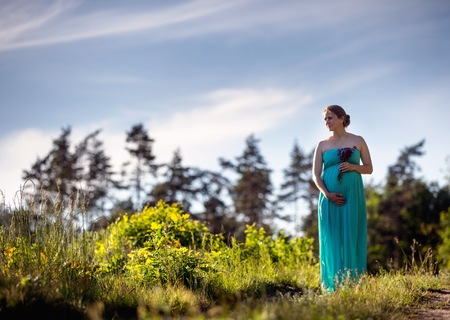 Pregnant woman outdoor portrait. Beautiful caucasian pregnant woman.の写真素材