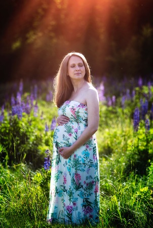 Pregnant woman outdoor portrait. Beautiful caucasian pregnant woman.の写真素材