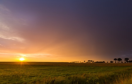 Beautiful sunset sky over meadows in Poland. Magical landscape.の写真素材