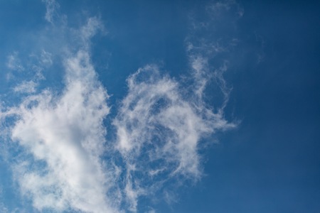 Blue sky with white clouds background. Abstract atmosphere backgroundの写真素材