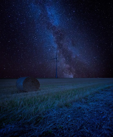 Starry sky over stubble field, fine art landscape. Dreamy landscapeの写真素材