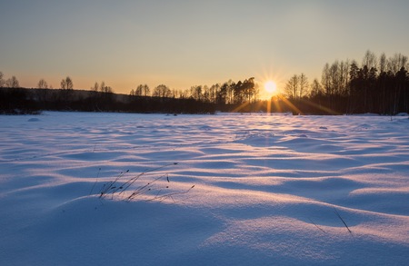 Winter landscape at beautiful sunny evening. Tranquil winter scene.の写真素材