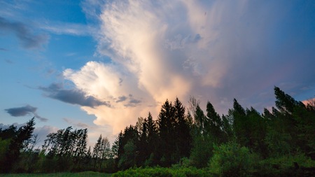 Storm clouds over rural landscape. Beautiful dramatic sky in polish landscape.の写真素材