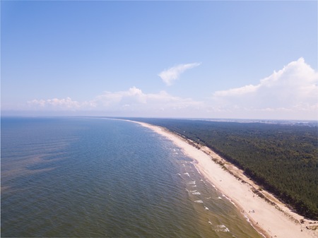 Baltic beach from above. Drone photography with sandy shore and waves of sea.の写真素材
