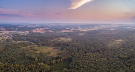 Beautiful misty evening panoramic landscape photographed from drone. Magical atmosphere.の写真素材