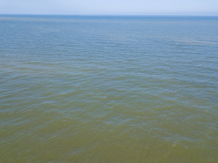 Baltic beach from above. Drone photography with sandy shore and waves of sea.の写真素材