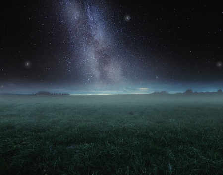 Surreal night landscape with starry sky. Dreamy look.の写真素材