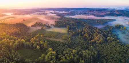 Beautiful foggy morning landscape photographed from above. Aerial landscape photographed in Poland.の写真素材