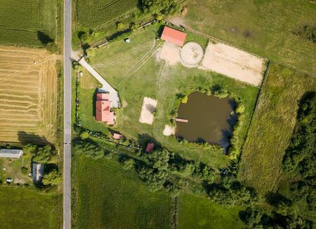 Top down drone landscape with buildings on fields. Farm from above.の写真素材