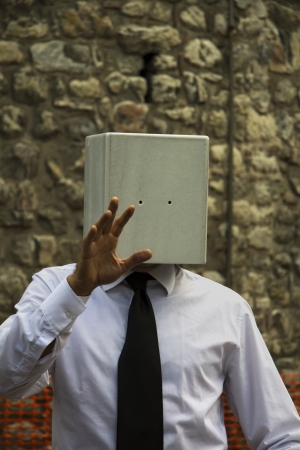 Stone-headed Businessman: This masked or stone-headed man symbolizing small-minded people.の写真素材