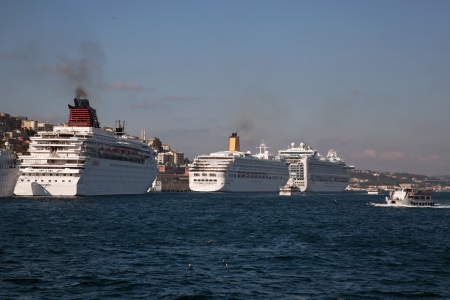 Istanbul, Turkey - September 6, 2011  Cruise Ships were docked at the Istanbul Bosphorus  Also a little boat was passing at the right side のeditorial素材