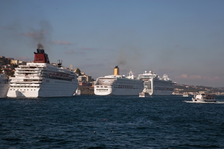 Istanbul, Turkey - September 6, 2011  Cruise Ships were docked at the Istanbul Bosphorus  Also a little boat was passing at the right side 