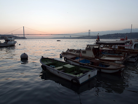 Fishing boats and Bosphorus Bridge at Istanbul,Cengelkoy,Turkey, after the sun goes down の写真素材