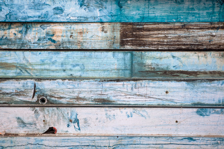 Painted old metal background looks like wood - blue, white, brown and yellow.の写真素材