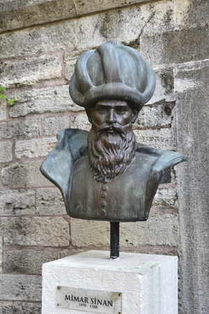 Istanbul, Turkey - September 8, 2016: The Great Architect Sinan's statue in front of an old stone building wall.のeditorial素材