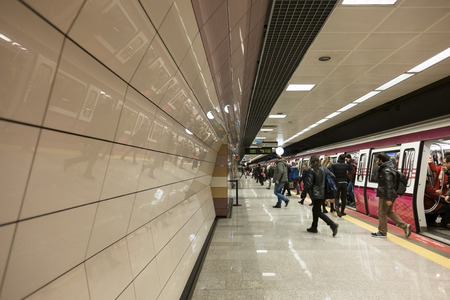 Istanbul, Turkey - February 10, 2017: People are getting out from the subway train at Istanbul Kadikoy-Kartal Subway. There is nice reflections at the wall.のeditorial素材
