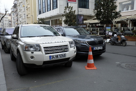 Istanbul, Turkey - February 24, 2018 : A beige Land Rover with new Skoda Karoq  were parked at The Nisantasi Tesvikiye Street at Istanbul. There are stores and cafes at the background with some peopleのeditorial素材