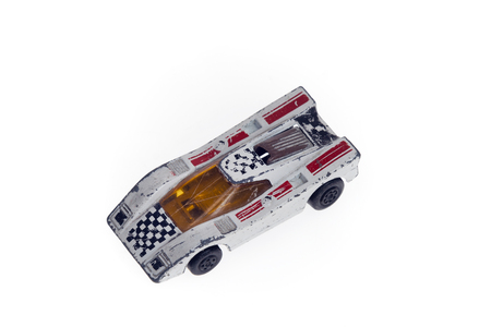 Antique toy car isolated on whiteの写真素材