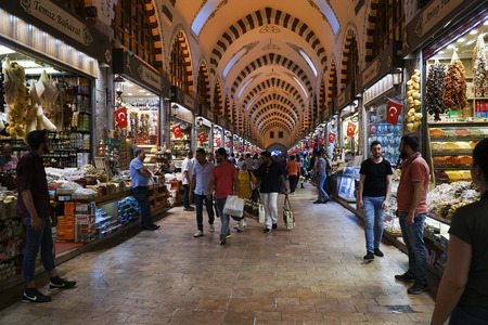 Istanbul, Turkey - May 17, 2018: The Famous Spice Bazaar in Istanbul with shopping tourists and shopkeepers. Arabian tourists are carrying shopping bags.のeditorial素材