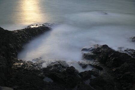 Long exposured rocks at the seacoastの写真素材