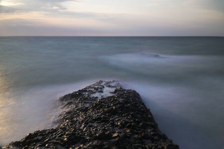 Long exposured rocks at the seacoastの写真素材