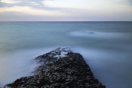 Long exposured rocks at the seacoastの写真素材