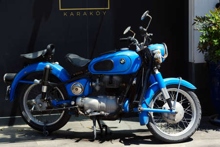 Istanbul, Turkey - May 19, 2021: A blue 50's vintage Bmw motorcycle at a street of Karakoy Istanbul staying under sunlight.のeditorial素材