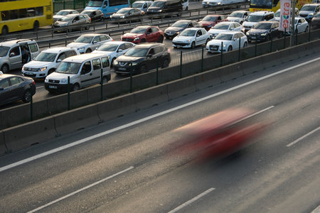Istanbul, Turkey - September 16, 2022: Traffic jam during the rush hour and a blurry fast going car on the empty side of the road in Istanbulの写真素材