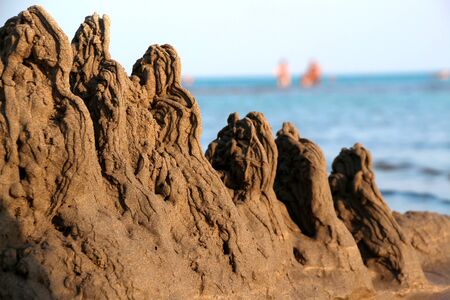 Children's sand reefs on the shore