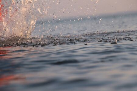 Bright background with splashing dropsの写真素材