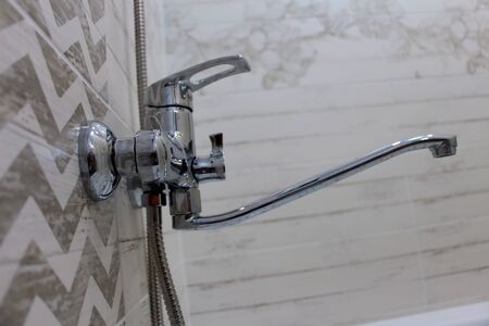 Elegant faucet shower tap in a bright bathroomのeditorial素材