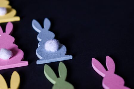 Close up of colorful Easter bunnies on blackの写真素材