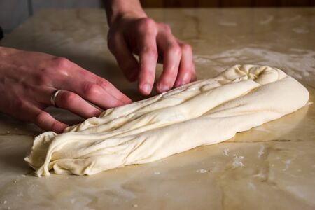 Woman, female hands making traditional Balkan pie, close up